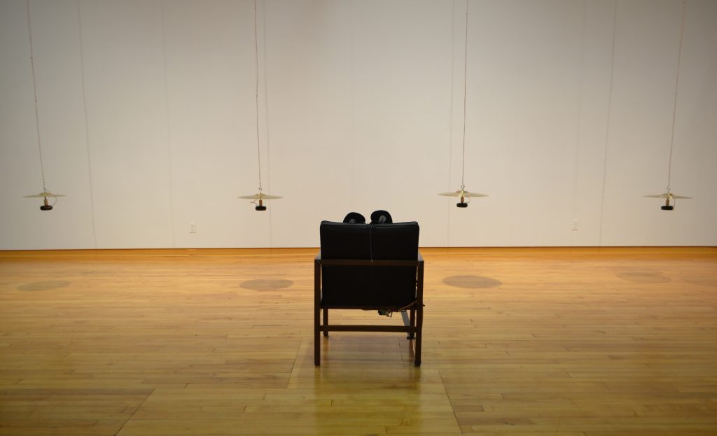 Chair with cymbals suspended in air